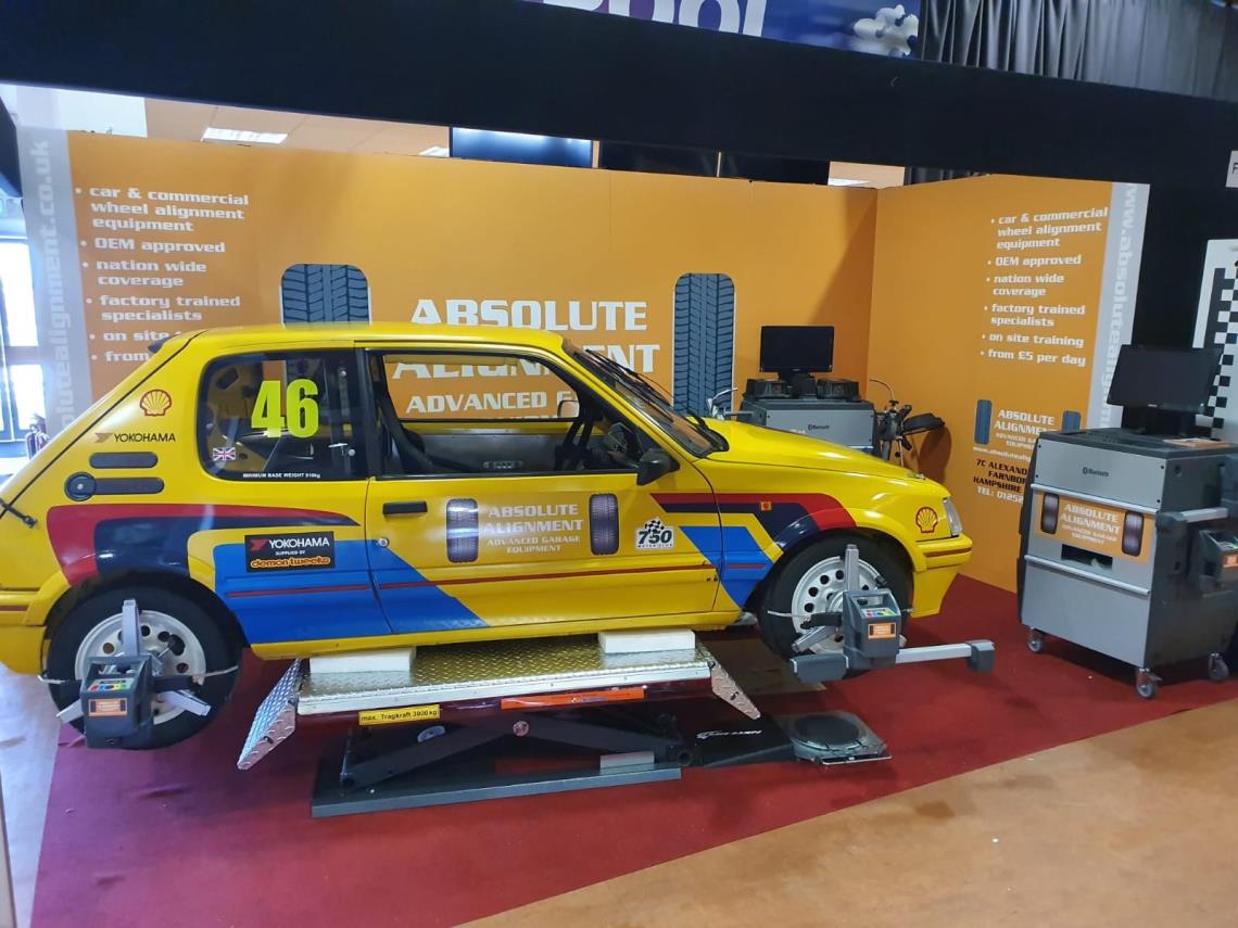 Peugeot 205 race car undergoing four wheel alignment